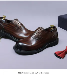 Close-up of brown leather brogue shoes with decorative perforations and shoe trees