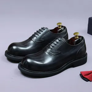 Men's black leather brogue derby shoes with classic oxford wingtip and polished finish