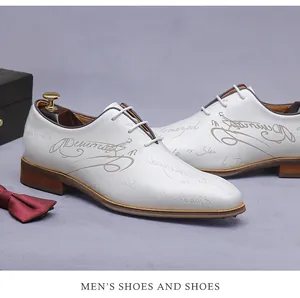 Macro detail of white leather derby shoes with elegant brown script pattern and wooden tree