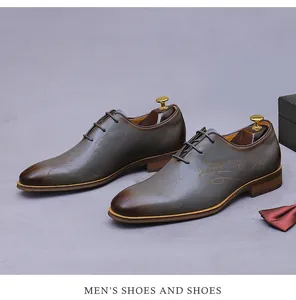 Detail of dark brown gradient leather oxford shoe with laser engraved script pattern