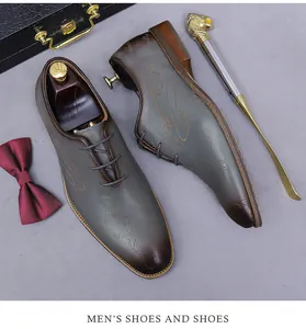 Detail of vintage laser-engraved leather oxford shoes with handmade text pattern