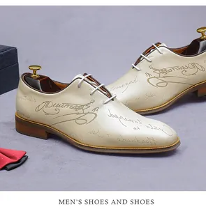 Detail of cream leather oxford shoe with script print and wooden shoe tree accessory