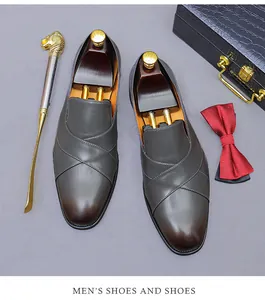 Men's leather loafers detail with cross strap and professional gentleman accessories