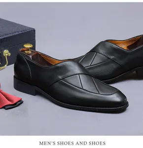 Detail of black leather loafers with cross-stitch design, bowtie and luxury props