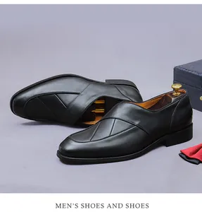 Detail of black leather men's business shoes with cross-stripe design and shoe tree
