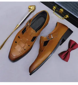 Detail of hand-woven brown leather upper and metal buckle on men's vintage business sandals