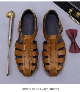 Detail of vintage brown leather men's sandals with metal buckle and premium texture