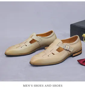 Detail of tan woven leather monk strap shoe with metal buckle and cutout texture