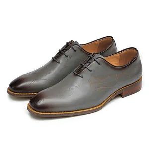 Brown gradient leather oxford shoes with Scritto engraved texture and classic laces