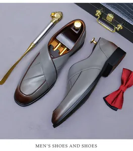 Detail of grey leather loafers with pleated vamp and vintage burnished toe box