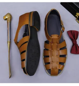 Detail of brown leather men's sandals with metal buckle and vintage woven strap design
