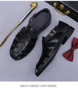 Macro view of woven black leather sandals with metal buckle and luxury accessories