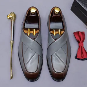 Men's grey leather dress shoes with brown gradient toe and formal gentleman accessories