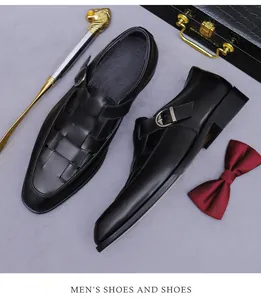 Close-up of woven leather texture and metal buckle on black hollowed business shoes