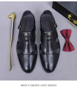 Macro detail of breathable hollowed-out black leather oxfords with metal buckle closure