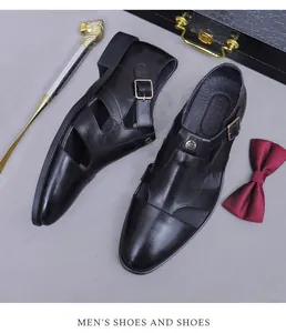 Detail of black leather dress sandals with cutout design and golden metal buckle accents