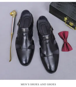 Close-up of black hollowed leather formal shoes with metal buckle and gentleman accessories
