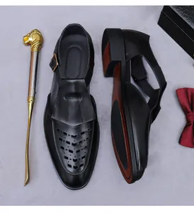 Top view of black hollowed leather dress sandals with metal buckle and premium accessories