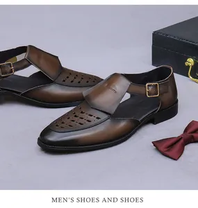 Close-up of brown leather hollow-out sandals with monk strap and geometric cut-outs