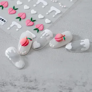 3D embossed peach and heart nail art stickers with cream design on matte grey background