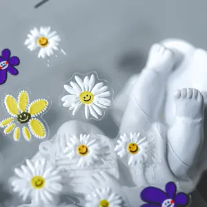 5D daisy nail stickers with 3D floral designs on transparent base for manicures