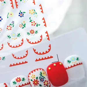 Floral nail art stickers with red daisies and colorful petal designs for manicure