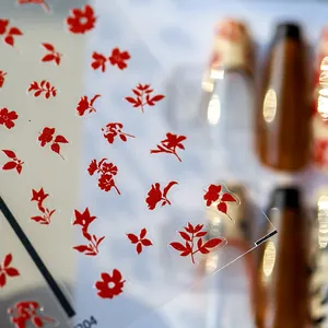 Japanese style thin floral nail stickers with red flower patterns and adhesive backing