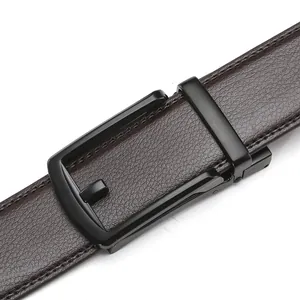 Close-up of brown lychee grain leather belt with matte black automatic metal buckle
