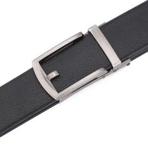 Macro shot of men's leather belt with lychee texture and brushed metal automatic buckle