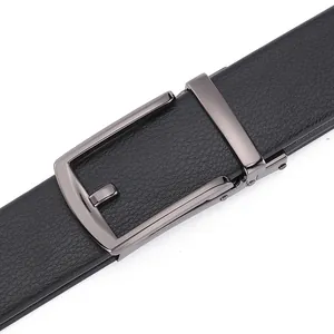 Detail of black lychee grain leather belt with polished dark grey metal automatic buckle