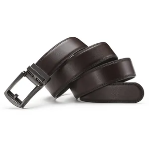 Macro view of dark brown leather belt with lychee texture and metallic gunmetal buckle