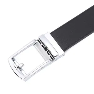 Macro detail of silver automatic buckle and black lychee grain leather belt strap