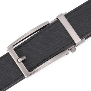 Close-up of men's leather belt with brushed metal automatic buckle and textured strap