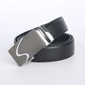 Detail of premium black leather belt showing matte silver alloy buckle with wave patterns