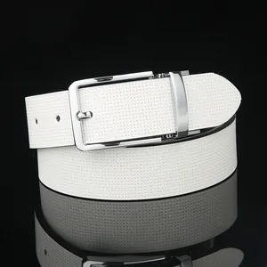 Close-up of men's white leather belt with textured surface and silver buckle reflecting on black surface