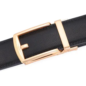 Close-up of black lychee grain leather belt with a polished gold automatic metal buckle