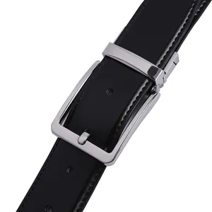 Detail of black textured leather belt featuring a silver pin buckle and white stitching