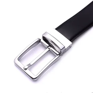 Detail of silver rotatable pin buckle with black leather belt and fine stitching