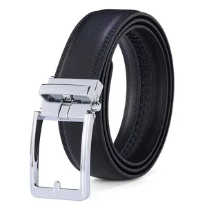Macro shot of men's leather belt showing fine grain texture and silver metal buckle