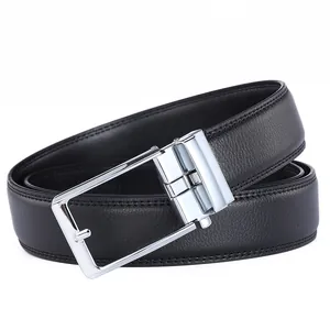 Close-up of black leather belt showing lychee grain texture and silver metal buckle