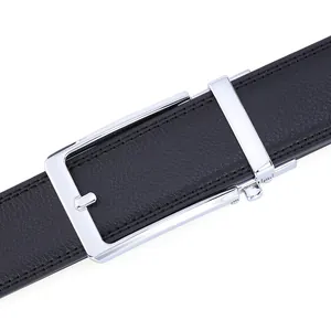 Detail of men's leather belt featuring a polished silver automatic buckle and lychee texture