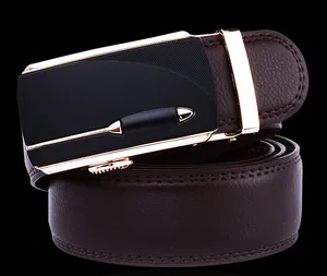 Macro shot of brown lychee-patterned leather belt with gold and black buckle