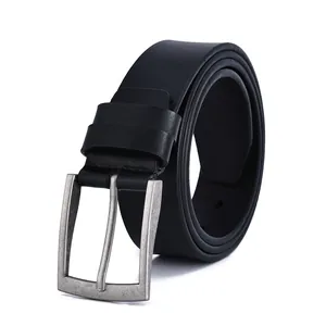 Detail of vintage silver pin buckle and matte black leather belt for men