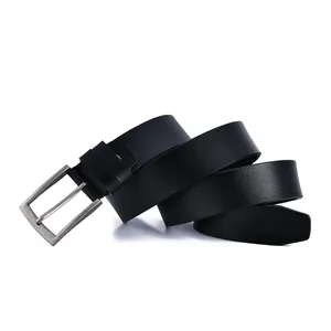 Detailed view of black leather belt with vintage silver-toned pin buckle on white surface