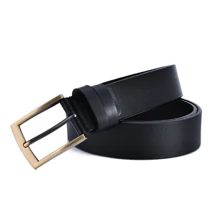 Detail of vintage brass buckle and high-quality black leather strap for men