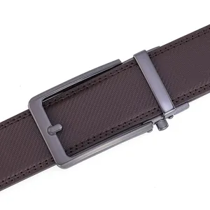 Detail of men's leather belt with gunmetal automatic buckle and textured strap