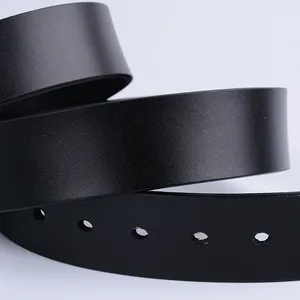 Detailed close-up of a black leather belt featuring clean adjustment holes and fine texture