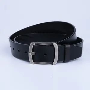 Detail of black leather belt showing matte silver square buckle and smooth texture