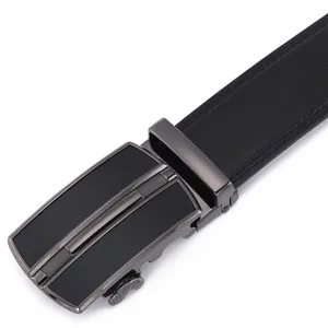Close-up of gunmetal automatic buckle with brushed finish on black leather belt