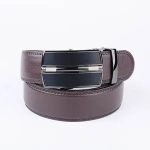 Close-up of men's leather belt with lychee texture and brushed black automatic buckle